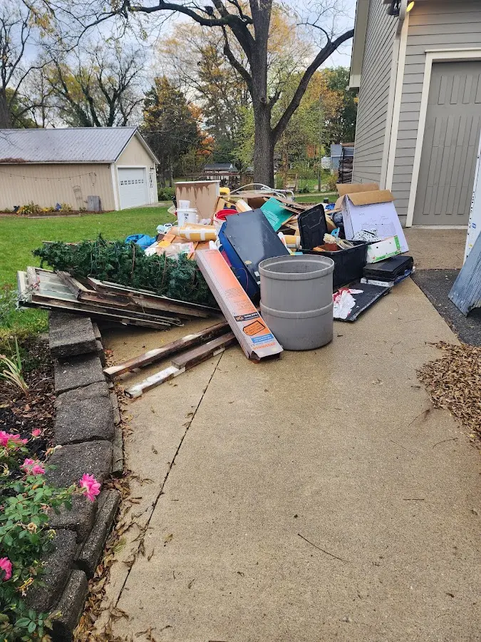Dumpster being loaded with debris for Residential Dumpster Rental in Decatur